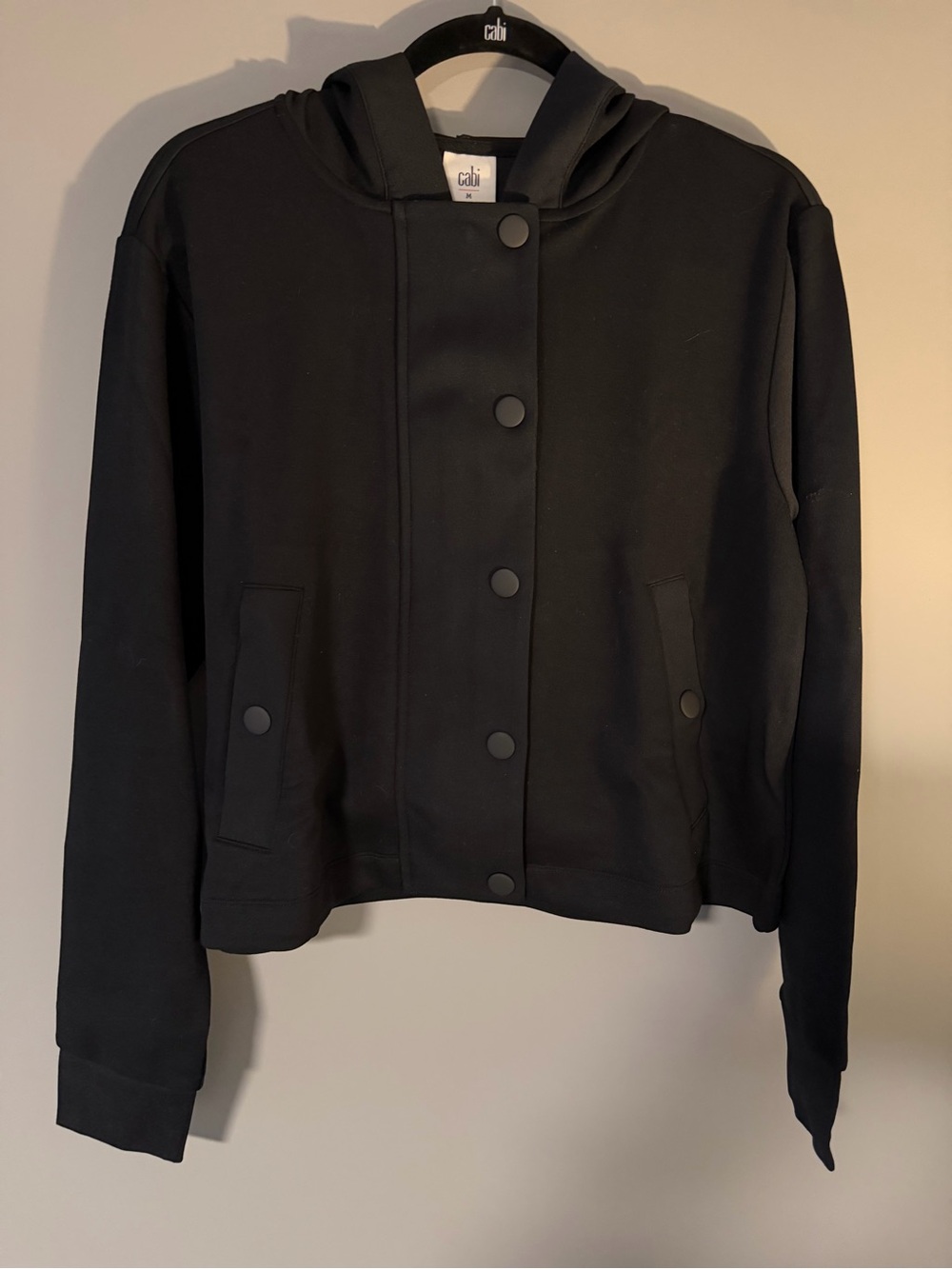 CAbi Black Hooded Snap-Front Bomber Jacket. Easy fit, Pique knit. Sz L.